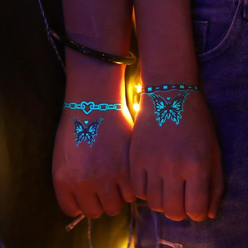 15 Sheets Glow-in-the-Dark Blue Luminous Butterfly Tattoo Stickers - Waterproof Temporary Tattoos with Feather, Deer, and Flower Patterns - Lasting 2-5 Days, Perfect for Shoulder, Finger, Wrist, Body, Clavicle, Arm, and Ankle Art for Women and Girls